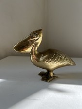 Pélican en laiton doré